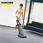 Vacuum cleaner being used in modern office by woman, industrial cleaning, professional hygiene equipment, beyond hygiene asia, carpet and floor cleaning, commercial cleaning solutions, Karcher brand, thorough sanitation in workplaces.