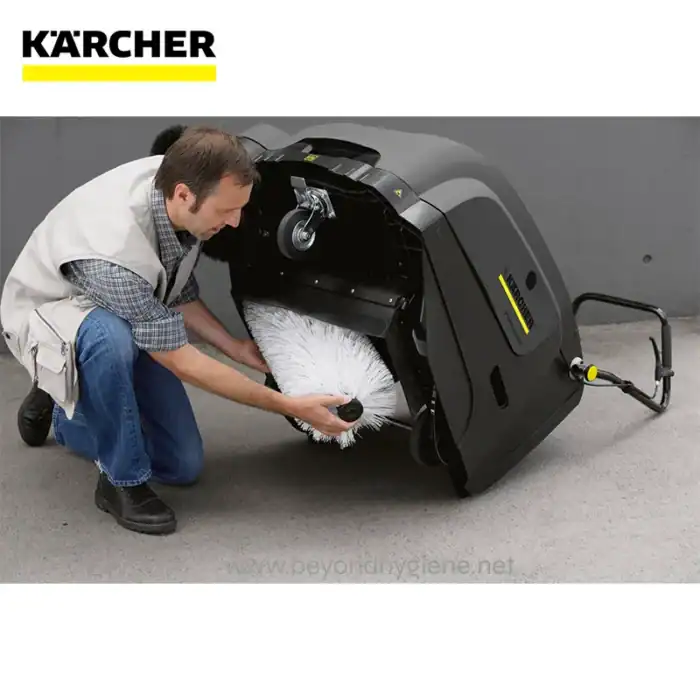 Karcher floor cleaning machine being maintained, focusing on hygiene and cleaning efficiency for commercial and industrial spaces.