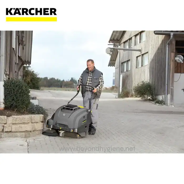 Powerful industrial cleaning machine operated by a professional in an outdoor environment, emphasizing clean and hygienic surroundings for commercial or industrial facilities.