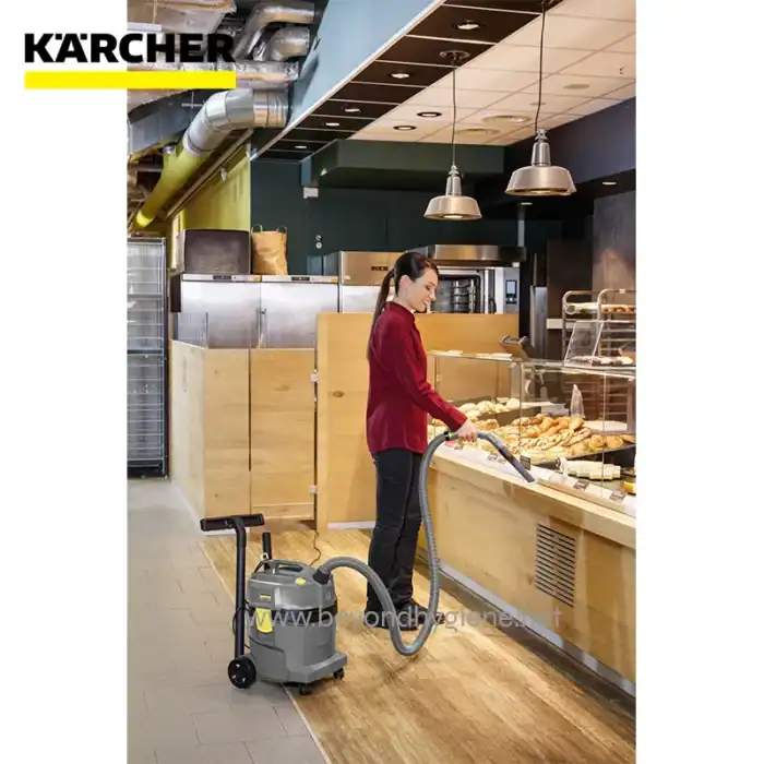 Karcher commercial vacuum cleaner cleaning bakery display case at Beyond Hygiene Asia, ensuring hygiene and cleanliness in food service environments for optimal hygiene standards.