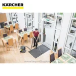 Disinfecting restaurant dining area with commercial vacuum cleaner and cleaning staff, maintaining hygiene standards, cleaning food service area, professional cleaning services in Asia, Beyond Hygiene Asia.