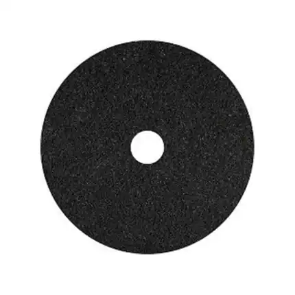 Black abrasive cleaning disc for industrial and household hygiene applications.