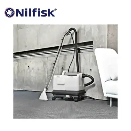 Nilfisk industrial vacuum cleaner cleaning an office space for hygiene and sanitation.