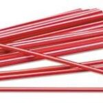 Red drinking straws isolated on white background, reusable and disposable options for beverages.