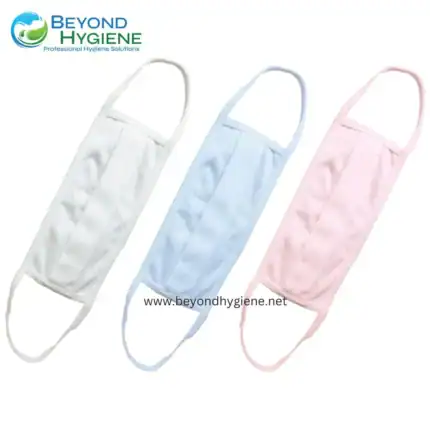 White, blue, and pink disposable face masks with ear loops for hygiene and protection, presented by Beyond Hygiene Asia, a professional hygiene solutions provider in Southeast Asia.