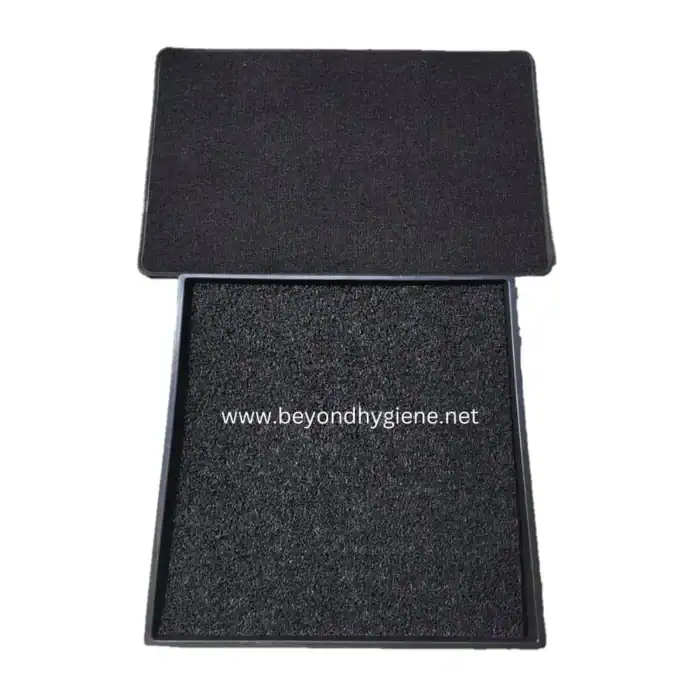 Black anti-slip shoe mat with removable cover for hygiene and safety at beyondhygiene.net.
