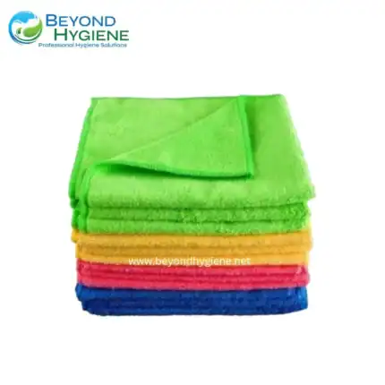 Microfiber cleaning cloths stacked in vibrant colors for professional hygiene maintenance.