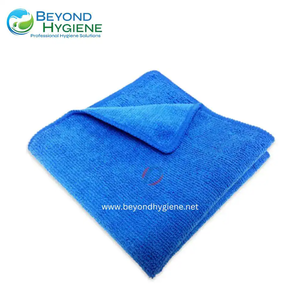 Microfiber cleaning towel in vibrant blue for professional hygiene and sanitation solutions. Suitable for healthcare, hospitality, and commercial cleaning services in Asia.