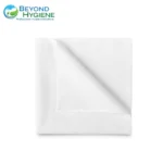 Disposable white tissue napkin, perfect for hygiene and cleaning needs at Beyond Hygiene Asia. High-quality paper suitable for various sanitary applications in professional hygiene solutions.