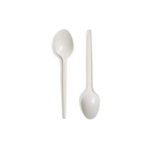 Disposable white plastic spoons for hygiene and food service.