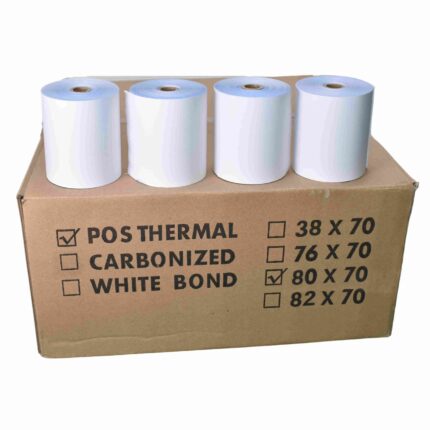 White thermal receipt paper rolls for POS printers on brown cardboard box, suitable for retail and hospitality industries.