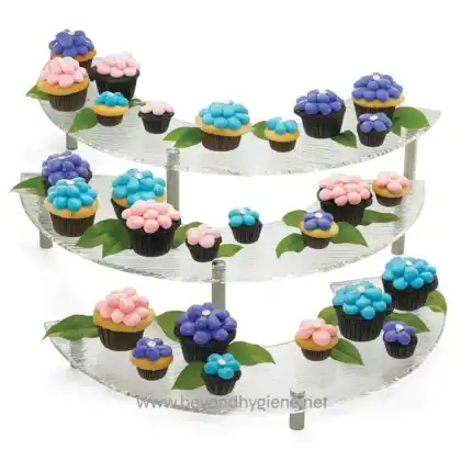 Miniature cupcakes with pastel frosting on a clear, tiered display stand, perfect for dessert tables or party decorations.