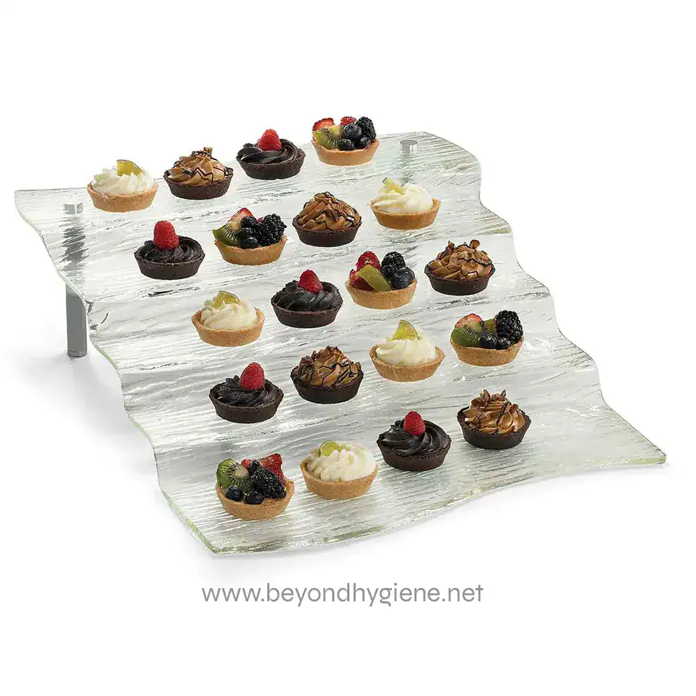 AW5_01.default Mini fruit and chocolate tartlets displayed on a decorative glass serving tray for elegant presentation. Suitable for catering, event displays, or dessert platters in hospitality settings.