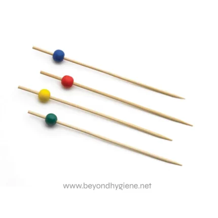Color-coded sewing pins on a white background, used for fabric marking and sewing projects.