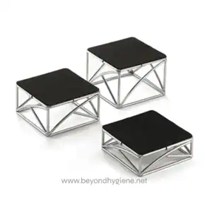 Stainless steel footstools with black cushioned tops, ideal for office or home seating arrangements.