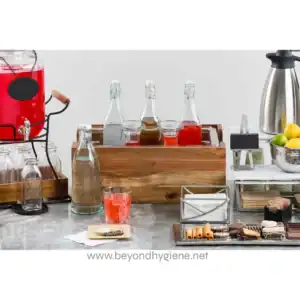 Beyond hygiene asia beverage station with assorted bottles and snacks for corporate or event catering.