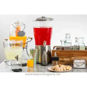 Juice and beverage dispensers with various drinks, straws, and snacks on a clean, modern table promoting professional hygiene and catering solutions.