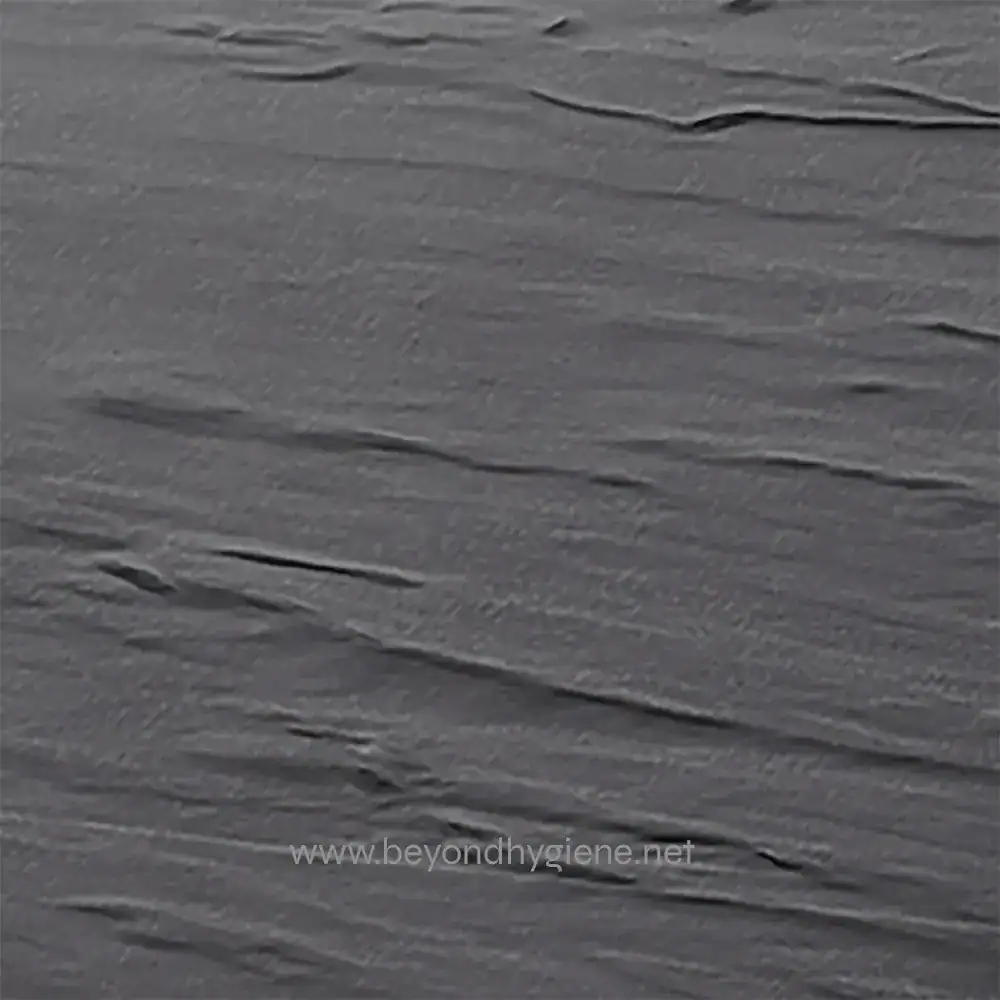 MG1_03 Gray textured surface resembling a wooden or stone finish with subtle streaks, ideal for hygiene or cleaning branding visuals.