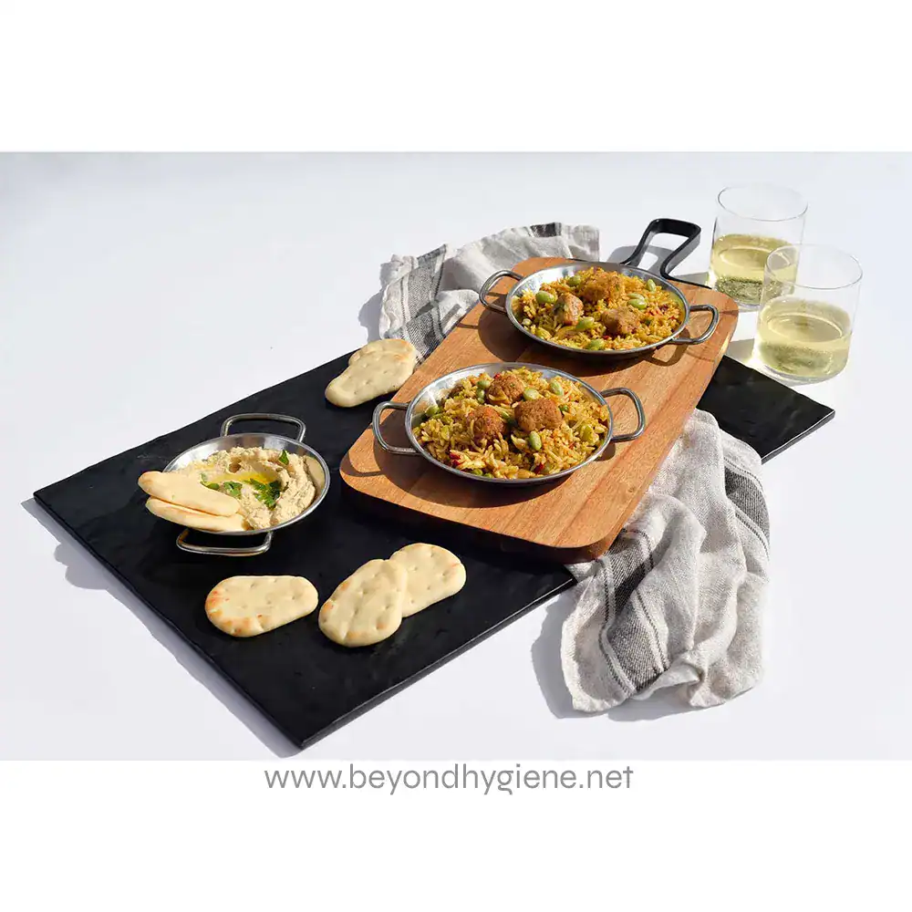MG1_ENV-18 Delicious Indian food with rice, naan bread, and drinks served on a stylish black and wood tray, showcasing hygiene and quality catering from Beyond Hygiene Asia.
