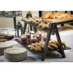 Delicious assorted baked goods and desserts displayed on a black multi-tiered serving stand at Beyond Hygiene Asia event.