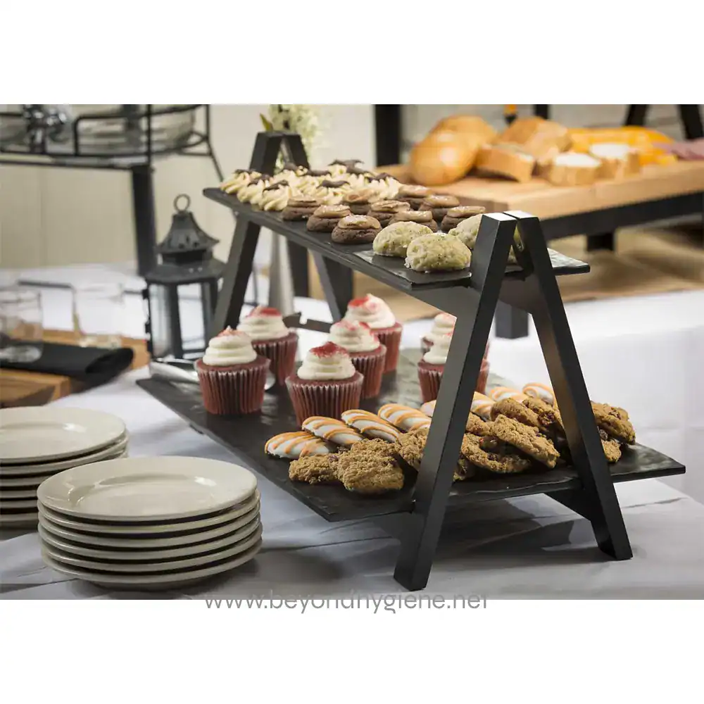MG1_ENV_3 Delicious assorted baked goods and desserts displayed on a black multi-tiered serving stand at Beyond Hygiene Asia event.