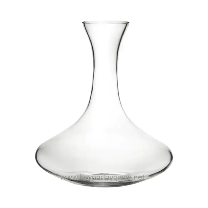 Clear glass decanter for alcohol or beverages, elegant and stylish. Perfect for home or bar use, showcasing sophisticated drink serving options.