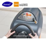 Sweeping cleaning machine steering wheel image for Beyond Hygiene Asia, commercial and industrial cleaning equipment, effective sanitation solutions, TASKI brand, Diversy partnership, professional cleaning machinery.