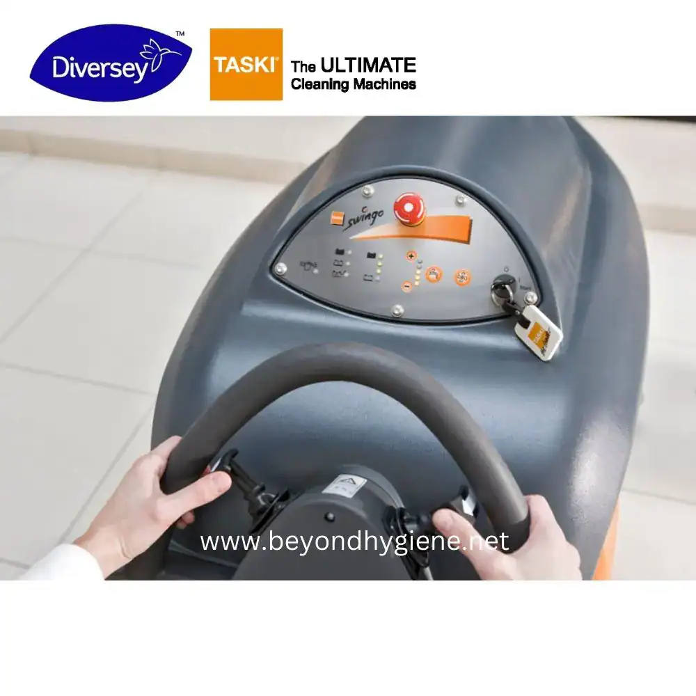 swingo 1850 _ TASKI (3) Sweeping cleaning machine steering wheel image for Beyond Hygiene Asia, commercial and industrial cleaning equipment, effective sanitation solutions, TASKI brand, Diversy partnership, professional cleaning machinery.