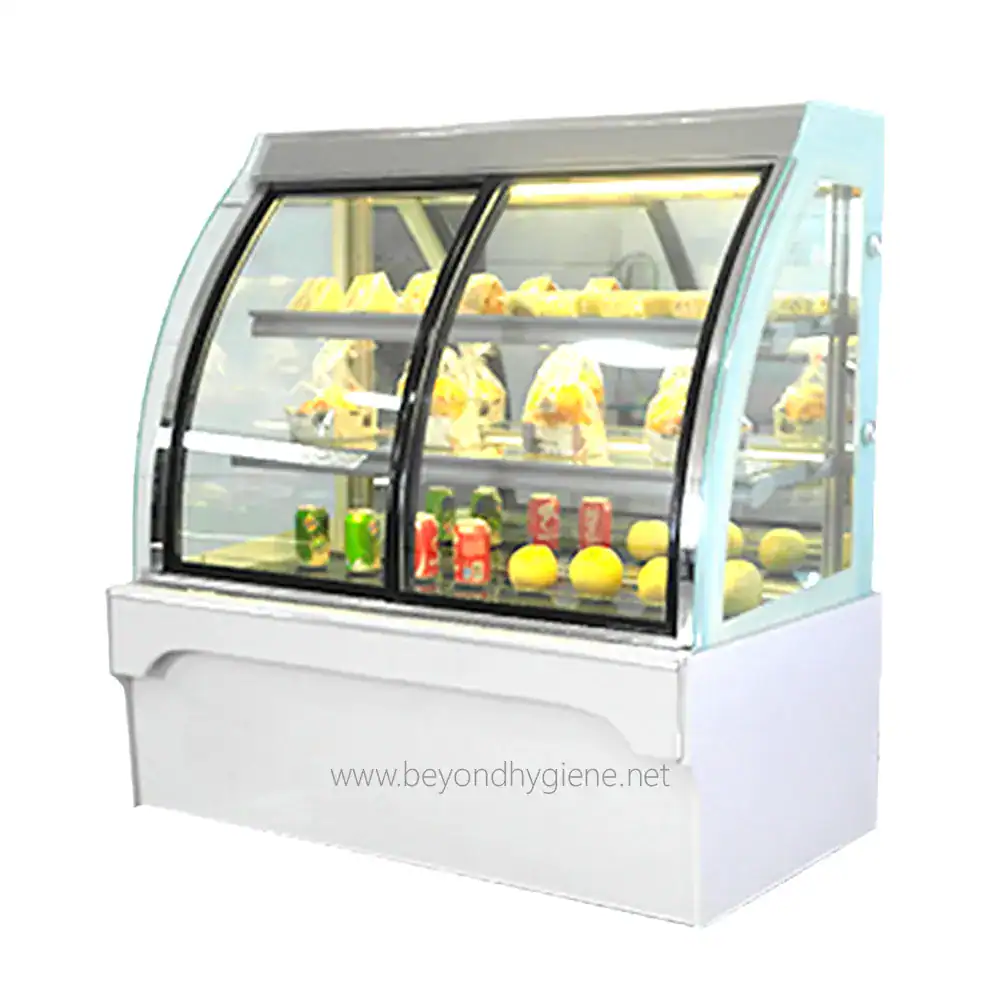 Cake Chiller TALL WHITE CHI-A90 Stainless steel refrigerated display case with glass front for showcasing food products, ideal for supermarkets, convenience stores, and foodservice establishments.