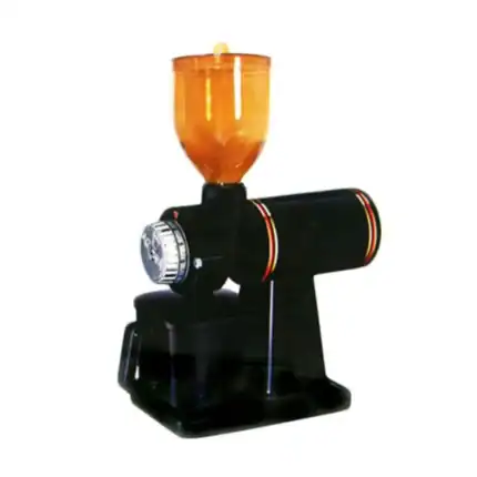 H, sanitizing device, ensuring hygiene with UV light sterilizer, orange sanitizer bottle on black device, used for disinfecting surfaces in hygiene-focused environments.