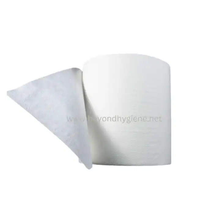 Pure white paper towel roll with one sheet partially pulled. Durable and soft for sanitation and cleaning purposes, ideal for commercial and healthcare environments.