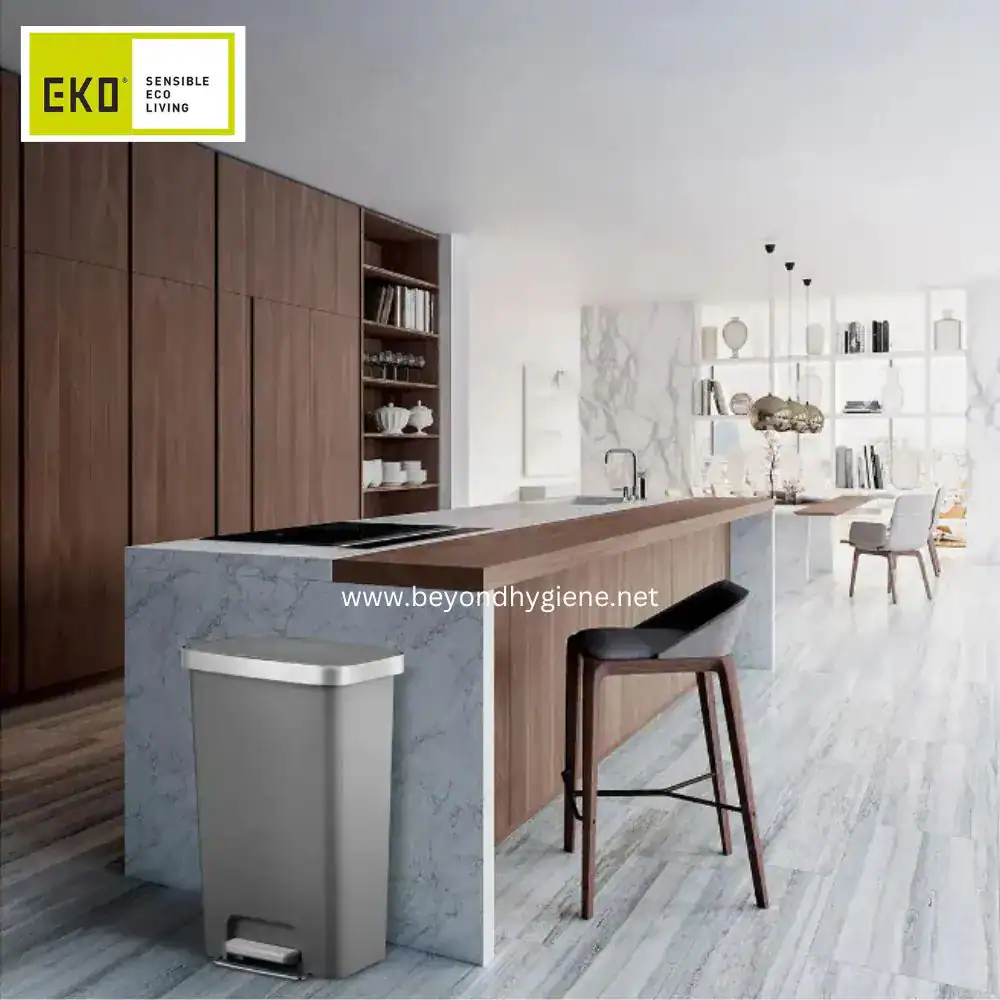 Hana Plastic Step Can 35L Gray (3) Stainless steel trash bin in a modern minimalist kitchen with wooden cabinets and marble countertops, emphasizing hygiene and eco-friendly waste disposal solutions.