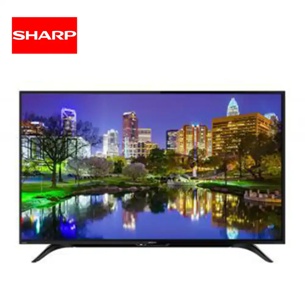 Sharp Full HD TV 2T-C45AD1X_1 Outdoor cityscape with illuminated skyscrapers reflected in a river, vibrant night scene.