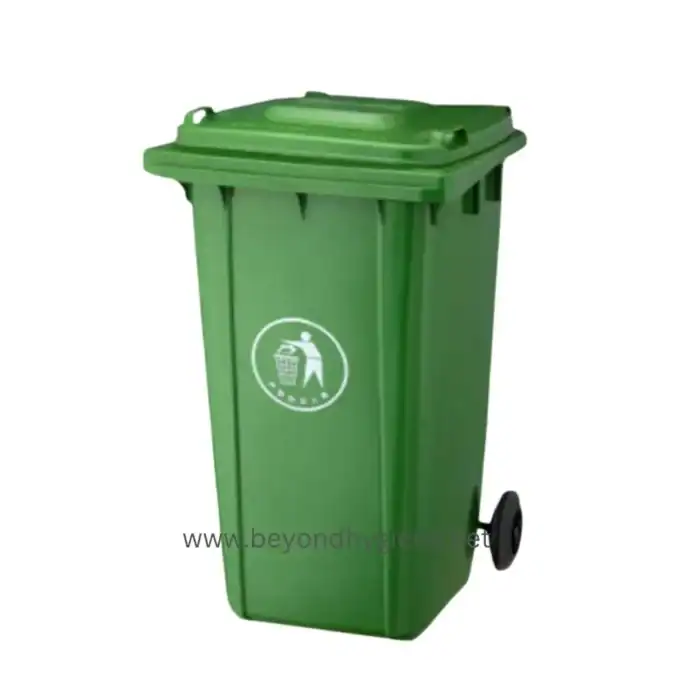 Green commercial garbage bin with wheels, ideal for waste management in public and industrial spaces. Durable and easy to move for efficient sanitation.