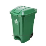 Green outdoor trash bin with lid and wheels for waste disposal.