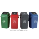 Green, red, black, and blue waste bins for recycling and waste separation, designed for commercial and public spaces by Beyond Hygiene Asia.