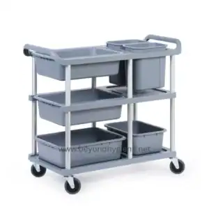 Gray hospital cleaning cart with multiple storage bins and wheels for easy mobility.