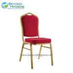 Chair with red upholstery and wooden frame for event or conference seating, part of Beyond Hygiene's professional hygiene solutions in Asia.