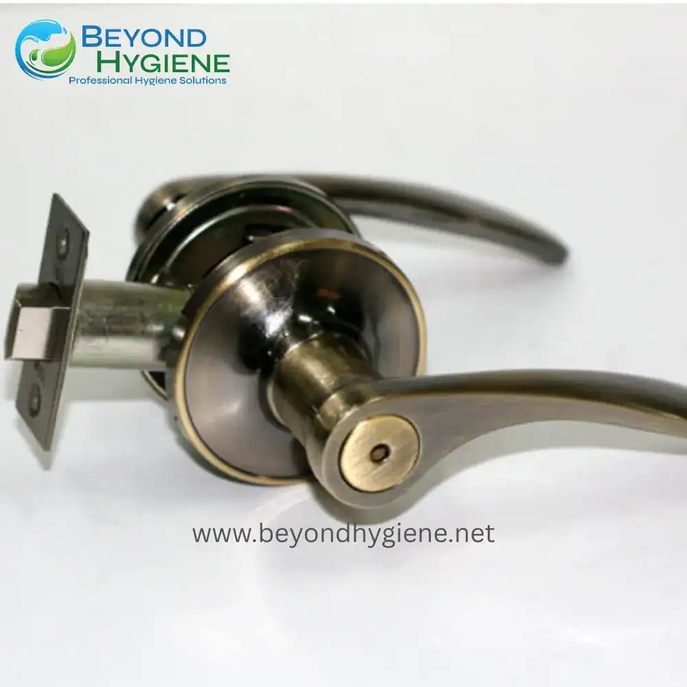 Bypass door lock handle with brass finish, heavy-duty door hardware for commercial and residential doors, from Beyond Hygiene Asia. Durable and stylish for professional hygiene solutions.